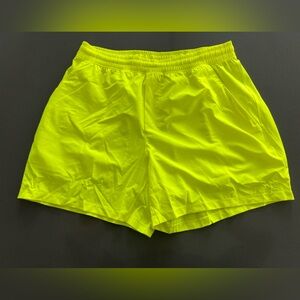 Neon yellow Lululemon pace breaker shorts